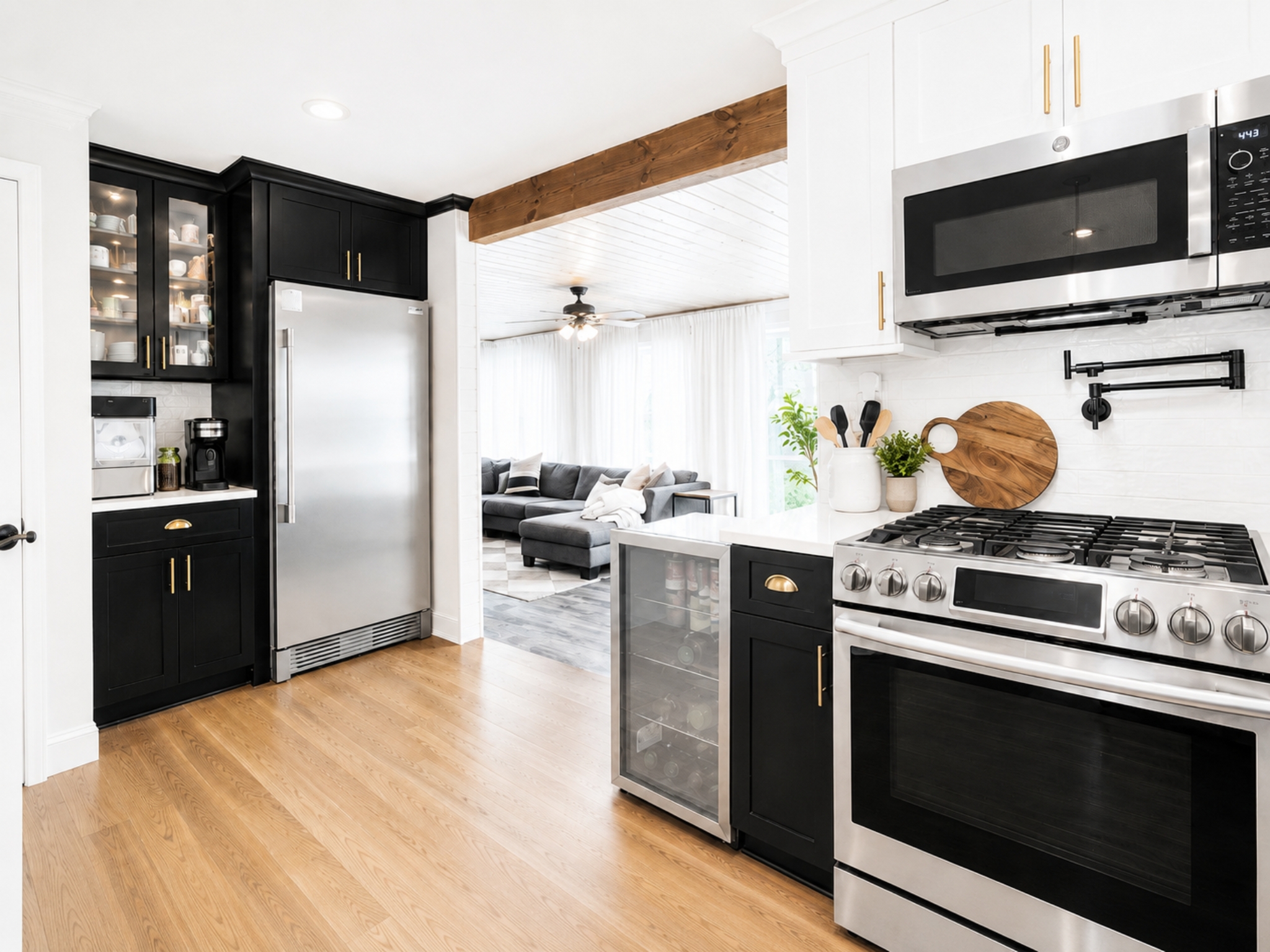 Black and white kitchen open to living